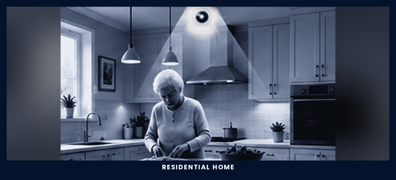 An older woman preparing food at her kitchen island in a residential home, with the ceiling sensor and its field of understanding above her.